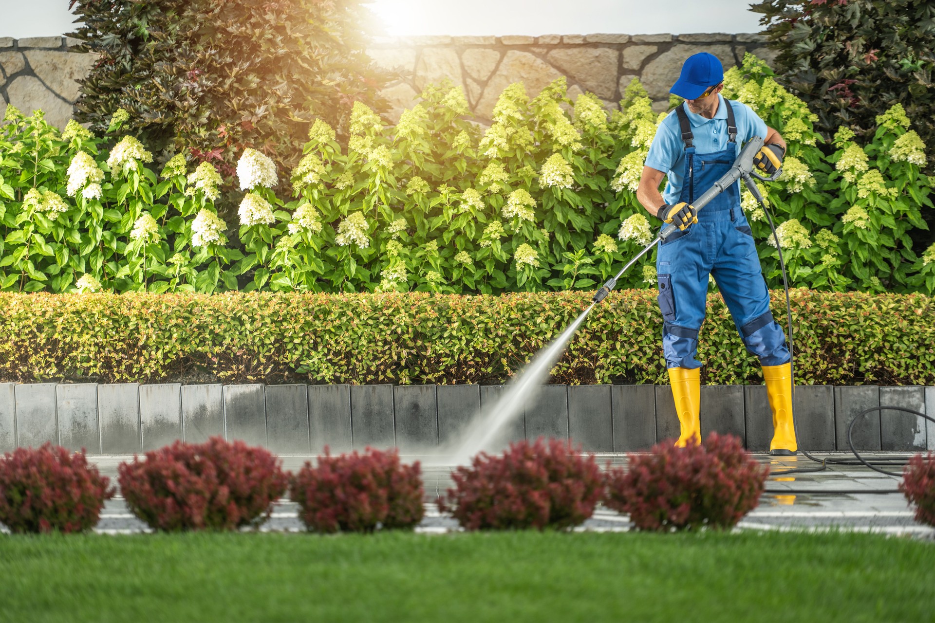 Washing Elegant Residential Driveway Using Pressure Washing Equipment